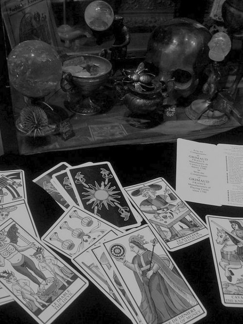 The Psychic, the Hanging Man, and the Debt to the Universe